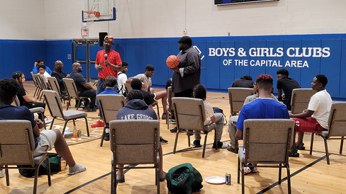 Men speaking with a basketball, Boys & Girls Club of the Capital BGCCA.