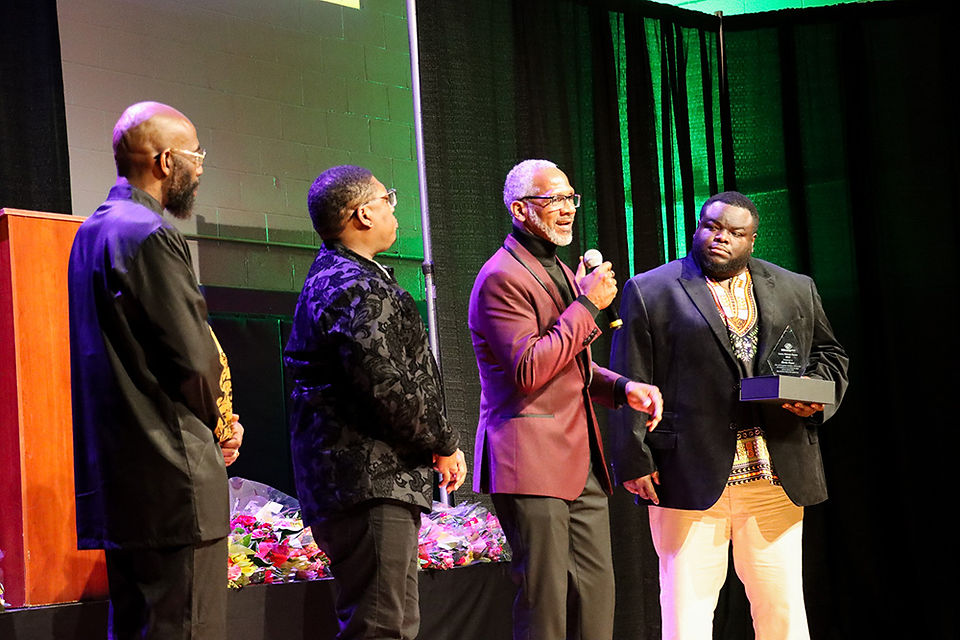 Group of men on stage at the 2025 Black History Heroes Gala.