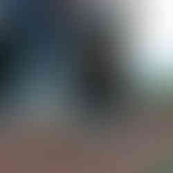 Student planting flowers in garden; Academy shirt, BGCCA community service project.