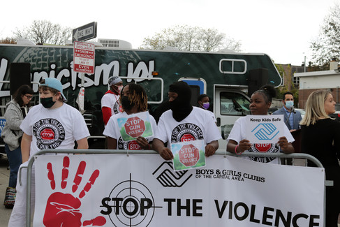 Group of people Stop the Violence holding signs BGCCA Racism 11/11/21 Keep Kids Safe.