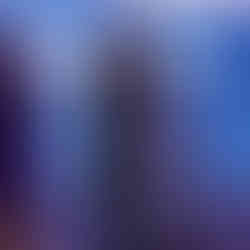 Woman speaking at podium with Girls Clubs Capital BGCCA organization details in background