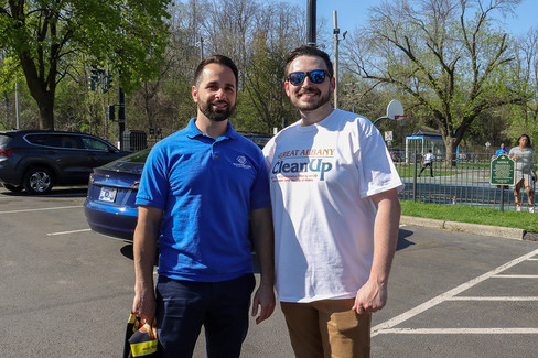 Two men smiling, shirt says: Great American Clean Up, outdoor setting, BGCCA.