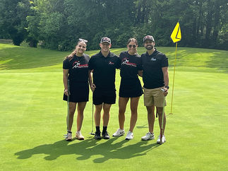 Four people on golf course. BGCCA team at 2025 Golf Tournament green.