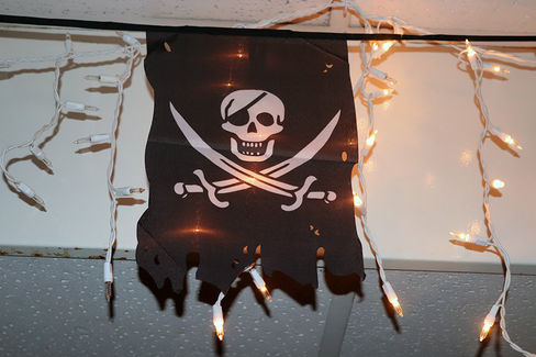 Pirate flag with skull and crossbones, string lights, 2022 Club Gala event.