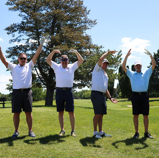 Four men on golf course making a circle gesture 2021 Chip In Fore Youth. BGCCA.