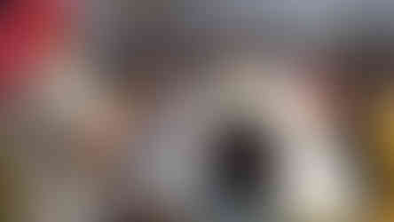 Children eating at a table in a room with food and drinks BGCCA 2022 Golf Tournament