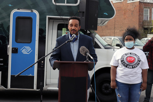 Man speaks at podium. BGCCA, Stop the Violence - 11/11/21, with text and logo.