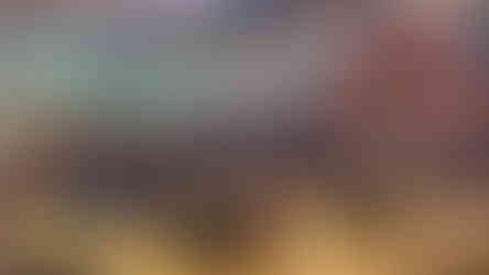 Children and adults seated in cafeteria with tables and food, BGCCA.