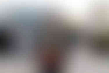 Man with arms outstretched speaks at podium with Stop the Violence - 11/11/21