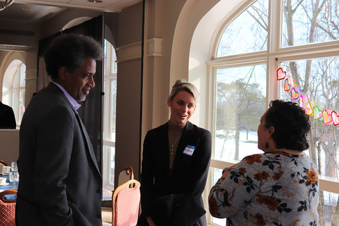 Three people conversing near a window; BGCCA CEO Transition and announcement.