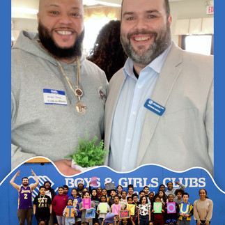 Two men smiling with a group of children, Boys & Girls Clubs BGCCA.