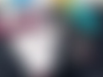 Pile of bookmars on a cutting mat, with scissors, rotary cutters, hole punchers, and thread