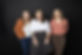 Photograph of 3 team members smiling