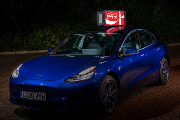LED taxi top display mounted on car roof.