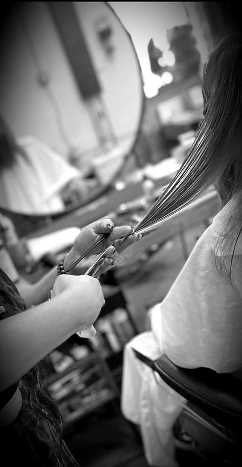 cutting men's long haircut