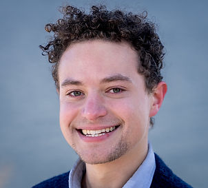 Young man with curly hair.