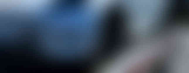 White Tesla on a rollback carrier flatbed