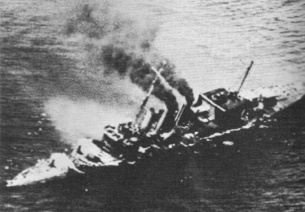 Cornwall listing to port, down by the head with the bows under water, shortly before sinking
