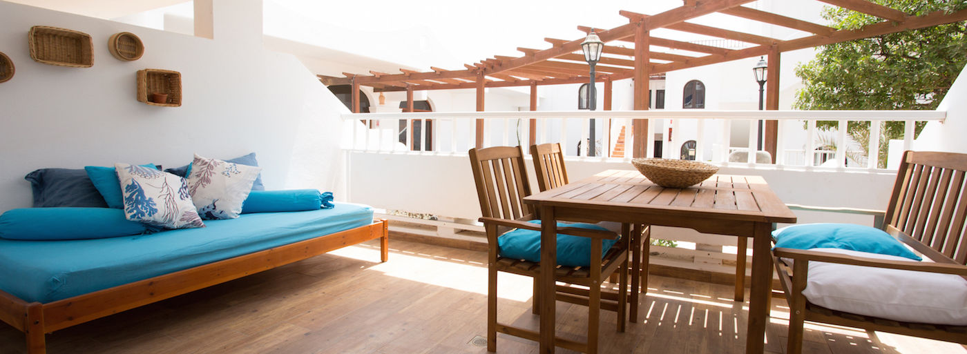 Bright modern living room and fully equipped kitchen in Apartment at Teguisol Holiday Apartments, Costa Teguise, Lanzarote