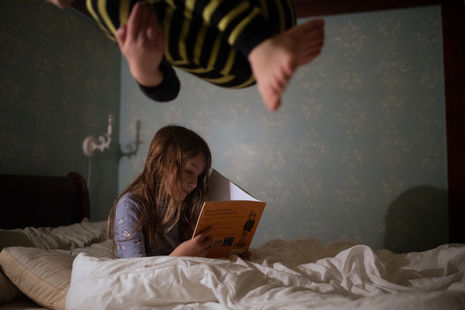 Bedtime reading is spent in the bed of their parents.