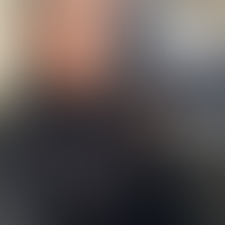 Stella Dove sits with her back to a window, wearing a black roll-neck sweater and leather trousers, long silver-streaked hair framing a gentle smile. You Do Not Have To Be Good — a lyrical reflection on belonging, softness, and the permission to simply be.