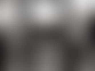 Photograph of Melancholia by sculptor Albert György — a hollow bronze figure seated in sorrow, symbolising grief, absence, and emotional emptiness. Overcast sky, bare trees, and distant water create a somber mood. Healing the Father Wound, a trauma-informed reflection on the impact of paternal absence and emotional neglect, exploring how inner child healing, emotional courage, and compassionate witnessing restore trust and belonging.