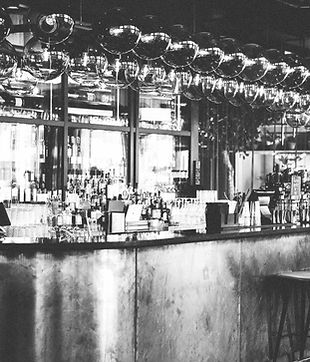 wide-shot-bottles-glasses-display-cabinet-bar-scandic-hotel-copenhagen-denmark_edited_edit