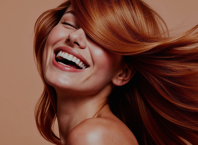 joyful-woman-with-flowing-red-hair_edite