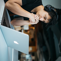 man wearing headphones while sitting on