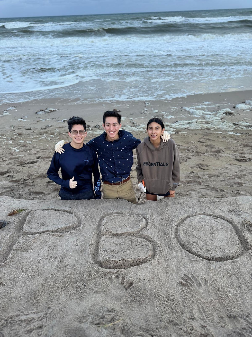 PBO during beach cleanup posing