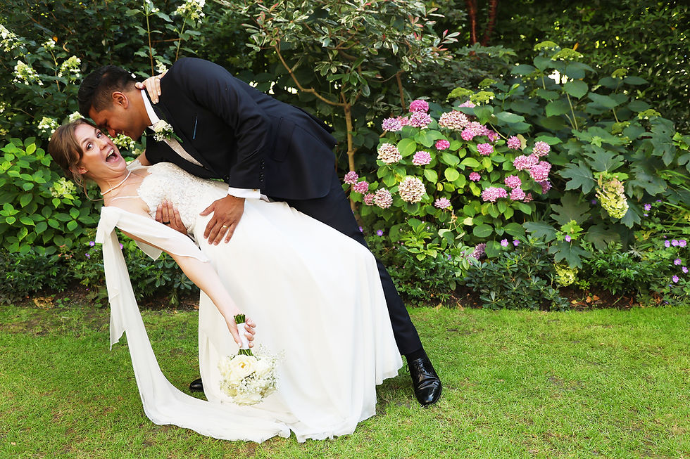 Relaxed bride and groom laughing together on their wedding day