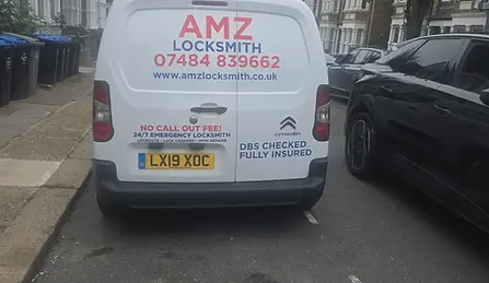 White AMZ Locksmith van parked on a street; Emergency Locksmith in Cricklewood