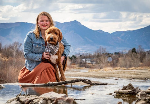 girl-with-dog-in-river-colorado-springs.jpeg