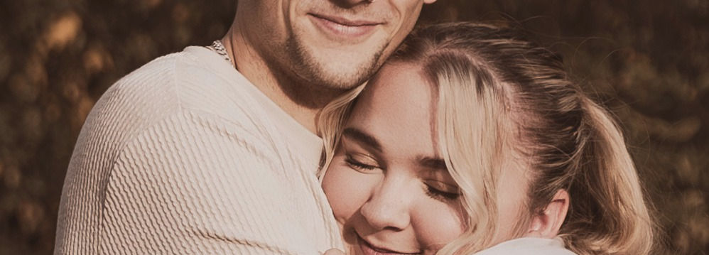 A loving young couple in each other's arms