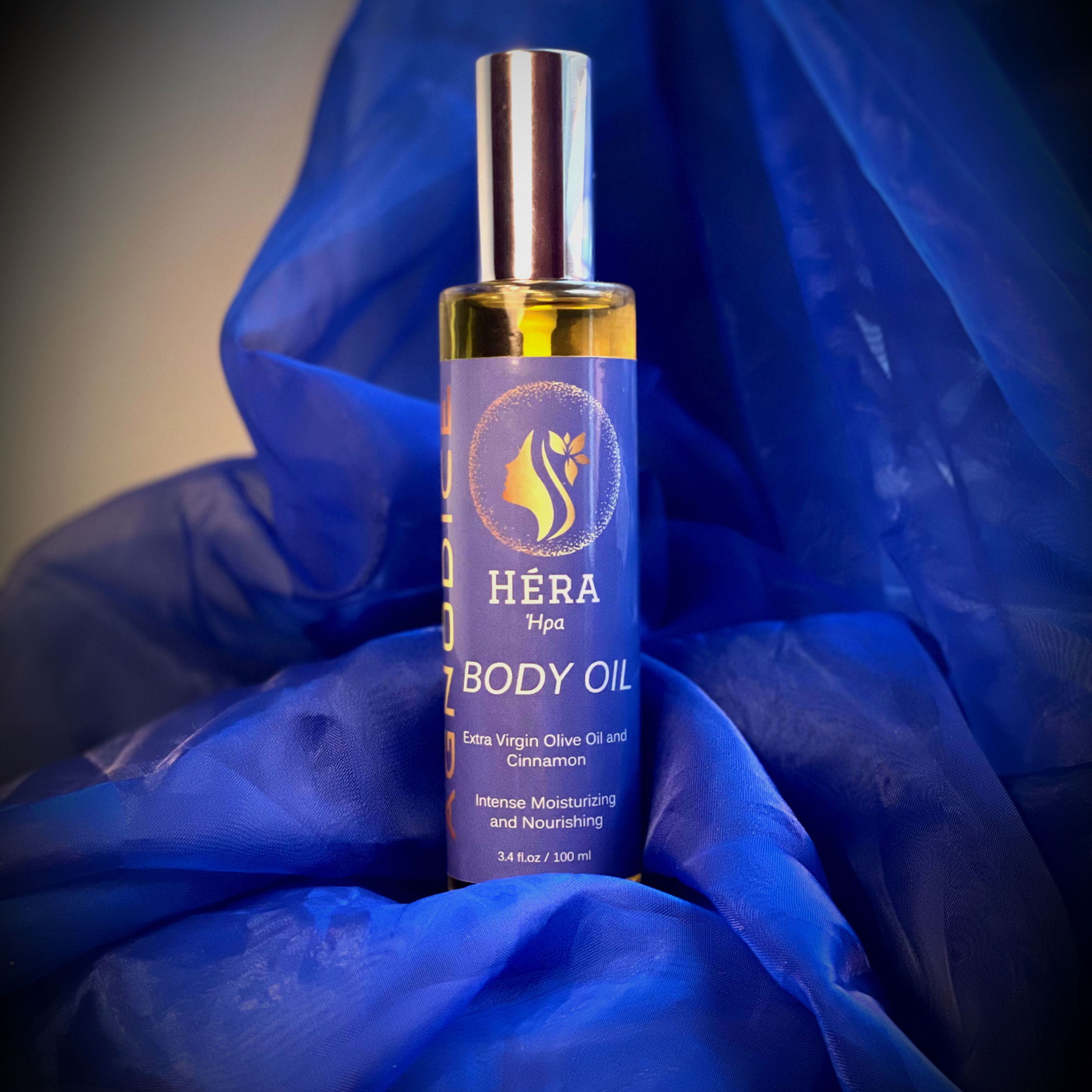 glass bottle standing on a blue cloth