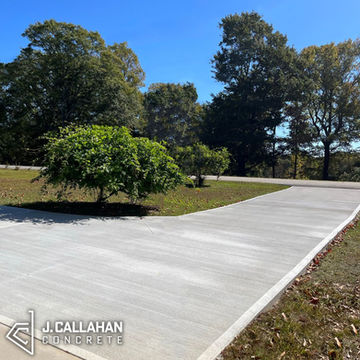 Side-view of a medium to long concrete driveway