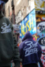 People in 3rd Base hoodies in a custom e-bike shop NYC area