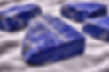 Raw Lapis Lazuli Gemstones Used at Fire & Stone Jewelry Studio Located in Taos, NM.png