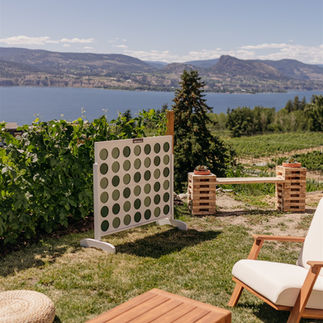 wedding lawn game rental in Penticton, giant 4 connect, lounge set, with Okanagan lake views in background