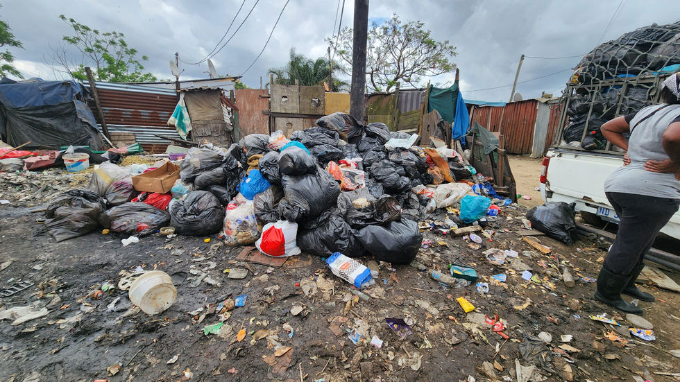 heap of trash between homes