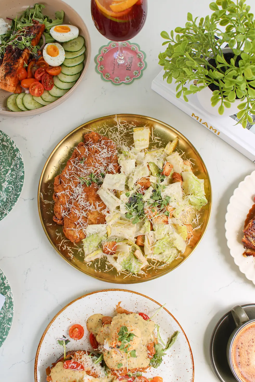 Milanese Caesar Salad with chicken, croutons, and parmesan at a brunch restaurant in Fort Lauderdale