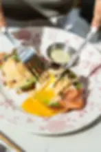 Smoked salmon benedict with avocado and capers at a brunch restaurant in Miami