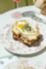 Truffle Croque Madame with ham and melted gruyere at a Miami Beach brunch restaurant.