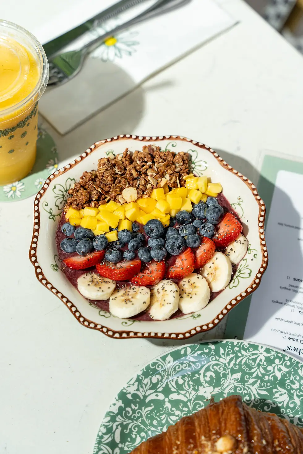 Acai bowl at Café Bastille in Fort Lauderdale topped with banana, strawberry, mango, and organic granola.