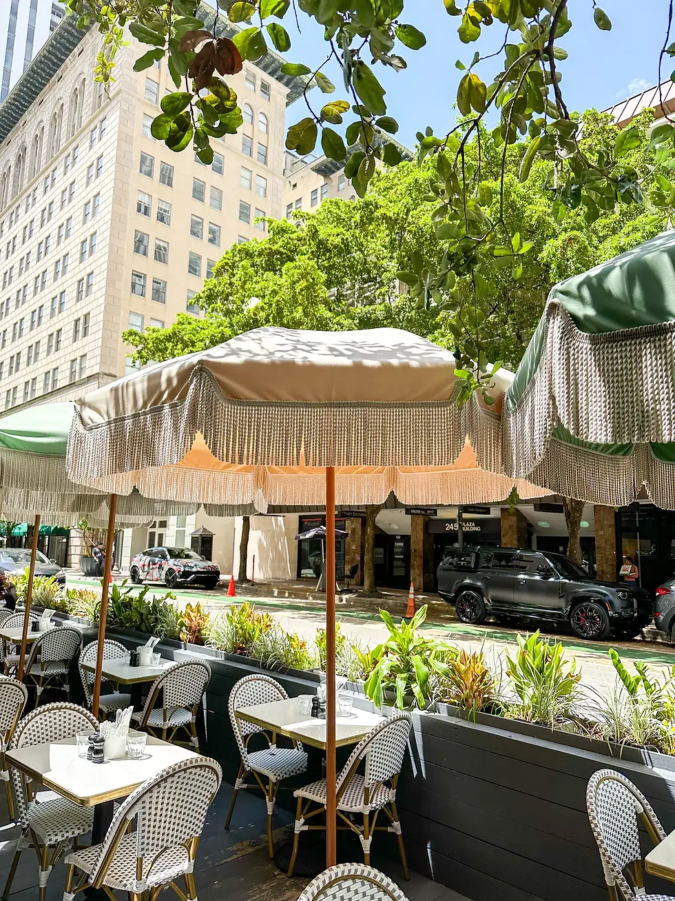 Outdoor seating at Café Bastille, a popular local brunch spot in Miami, perfect for enjoying the best brunch in Miami with a cozy Parisian vibe