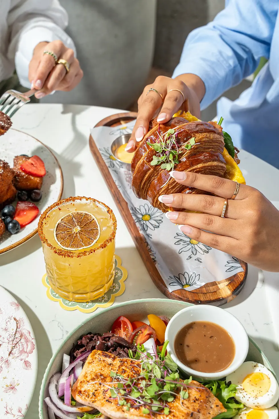 Breakfast croissant with eggs and avocado at a French-inspired brunch restaurant in Miami.
