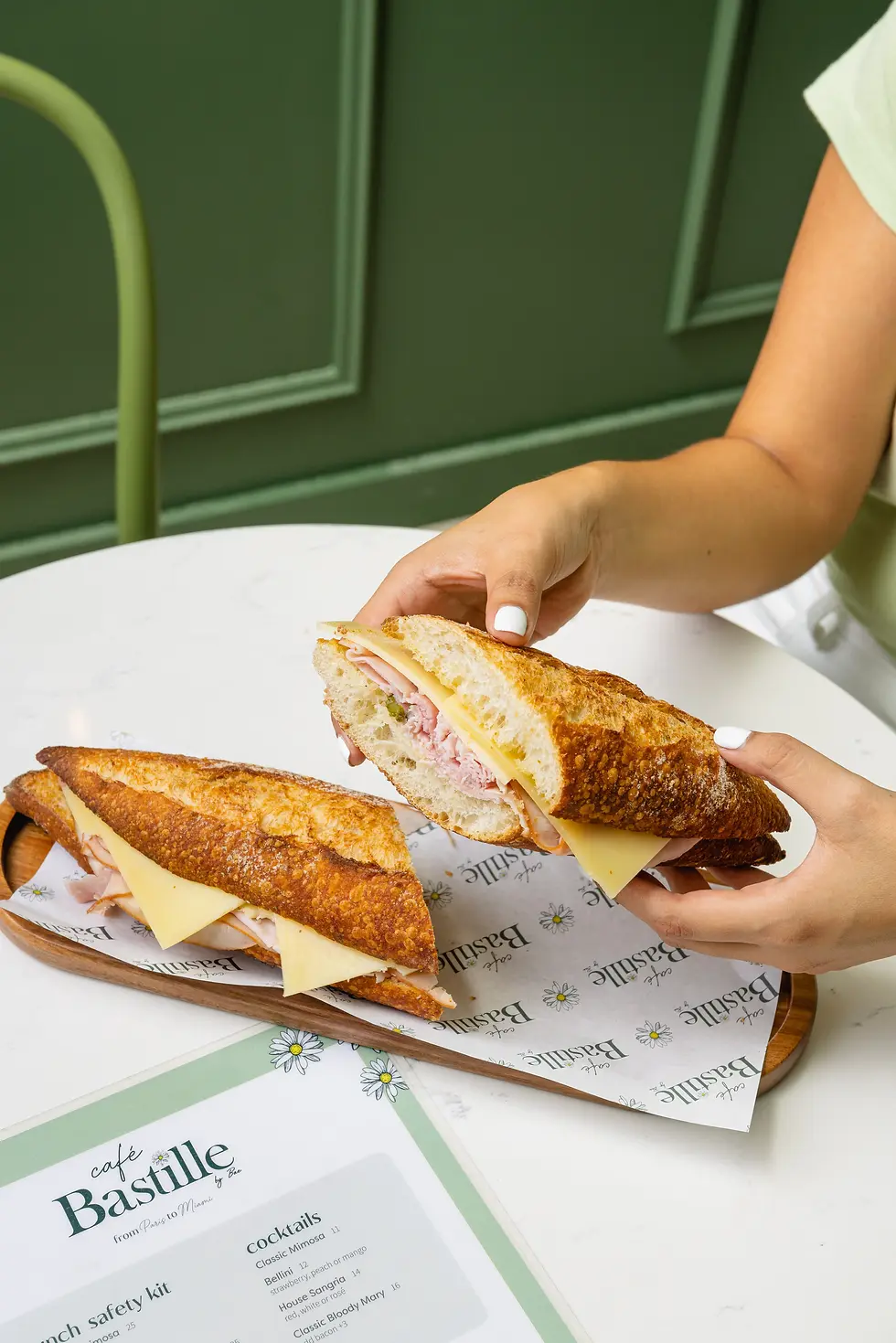 French Ham & Cheese sandwich with buttered baguette, ham, gruyere, and cornichons.