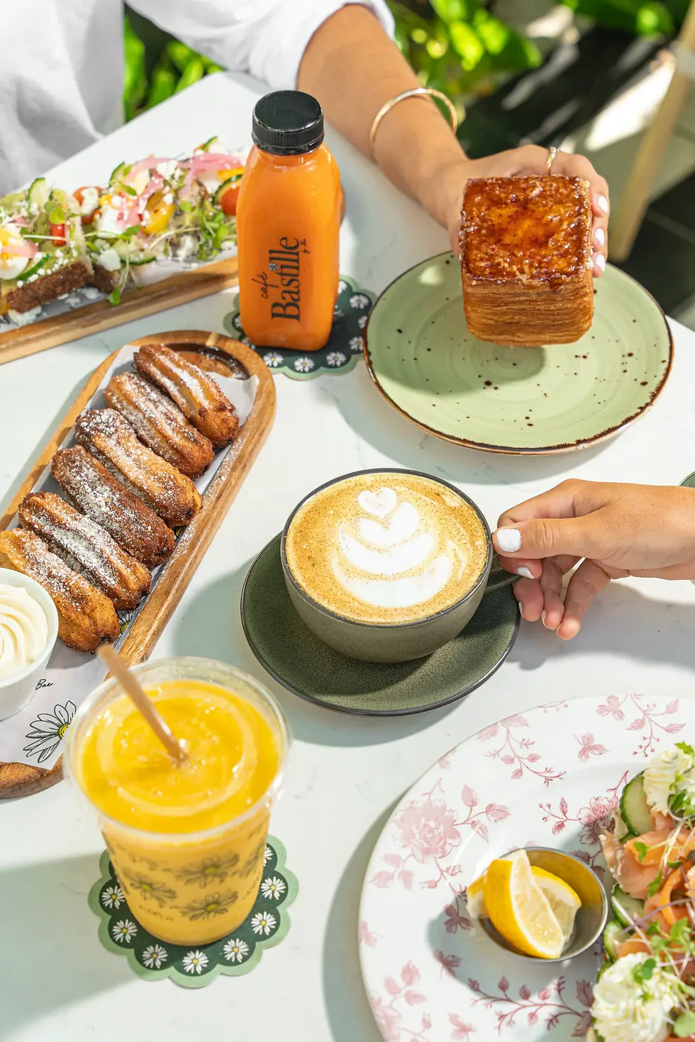 Variety of lunch dishes at Café Bastille, a popular lunch restaurant in Miami offering flavorful options