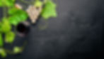 grape-motive-bottle-glass-wine-grape-leaves-top-view-free-space.jpg
