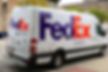 FedEx van delivering a GuardBox security camera rental to a New York City job site in under 24 hours from purchase.